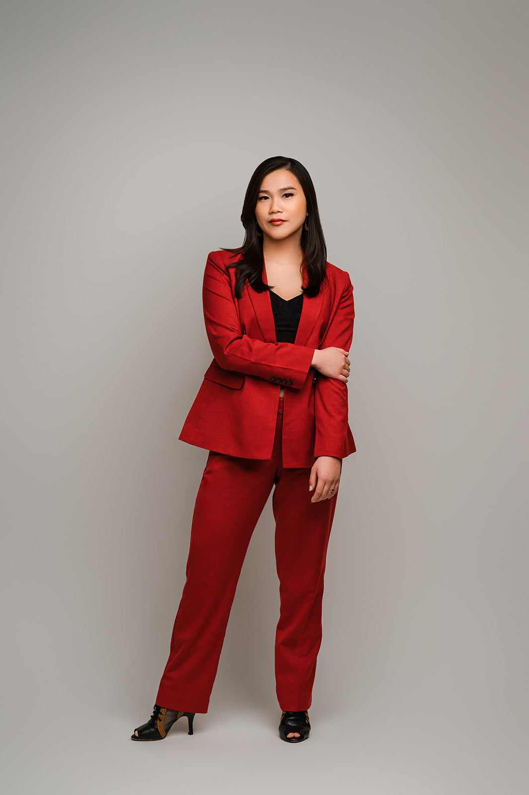 Fullshot of company founder with one arm crossed