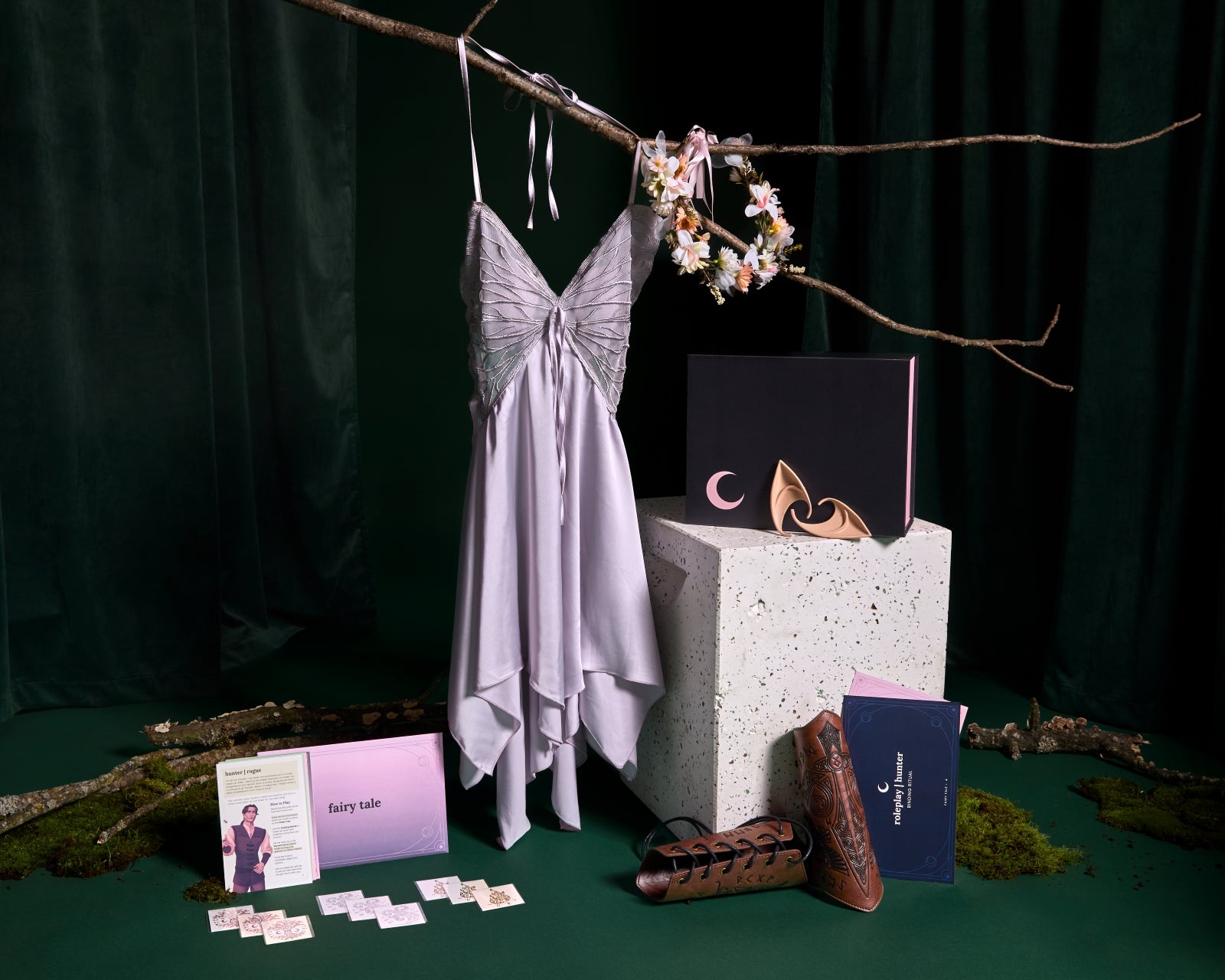 Collection of items from Fairy Tale Classic Box in front of green background